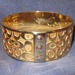 gold-tone COACH cuff bracelet C logo with button-snap-look design jewelry